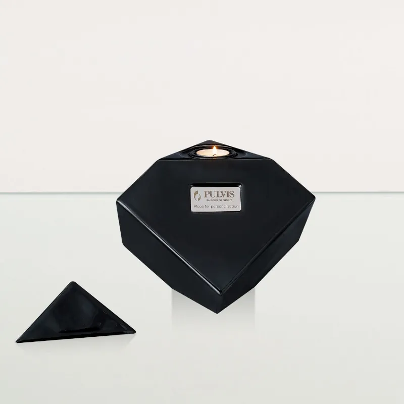 Pulvis Art Urns Abstract large lamp black ceramic cube cremation urn balanced on edge with candle holder