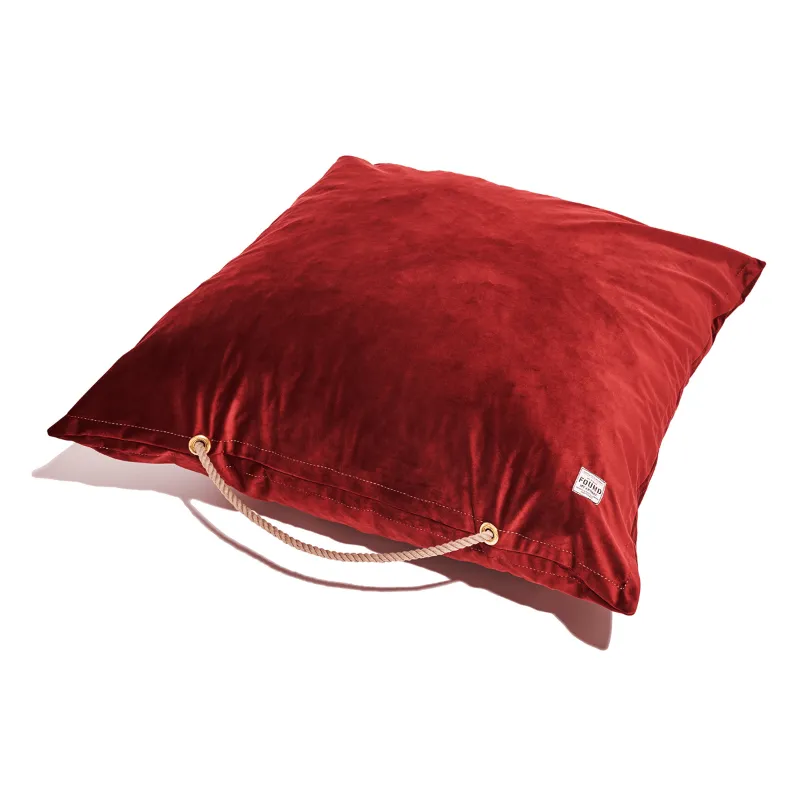 Found My Animal Burgundy Washable Velvet Dog Bed shown on a floor with dog resting on it, full view