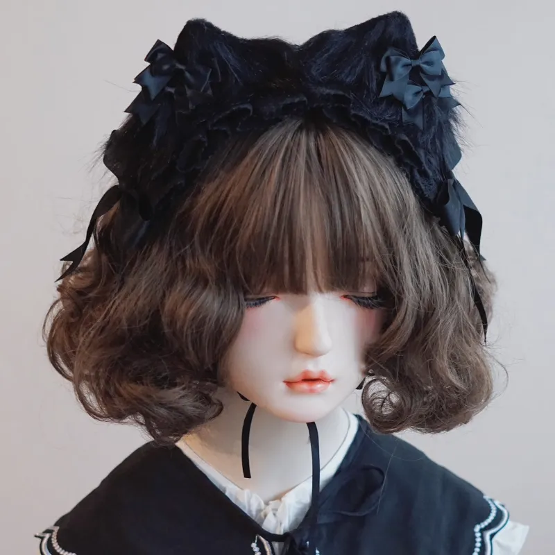 Juwas Black Bow Lace Cat Ear Headband front view highlighting the lace edges and central bow placement.