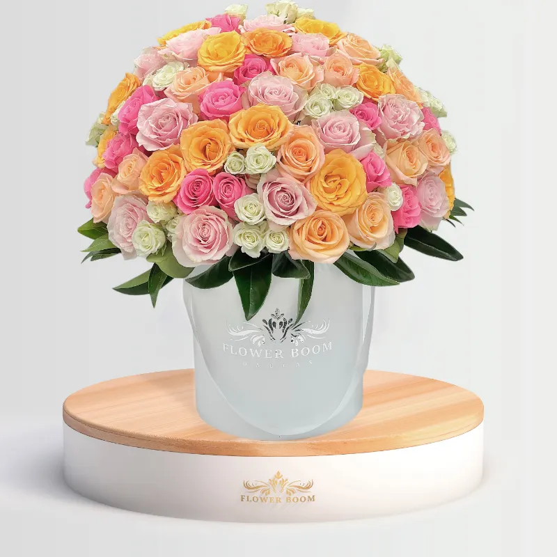 Flower Boom Dallas Caramella arrangement with assorted fresh roses and green hypericum berries
