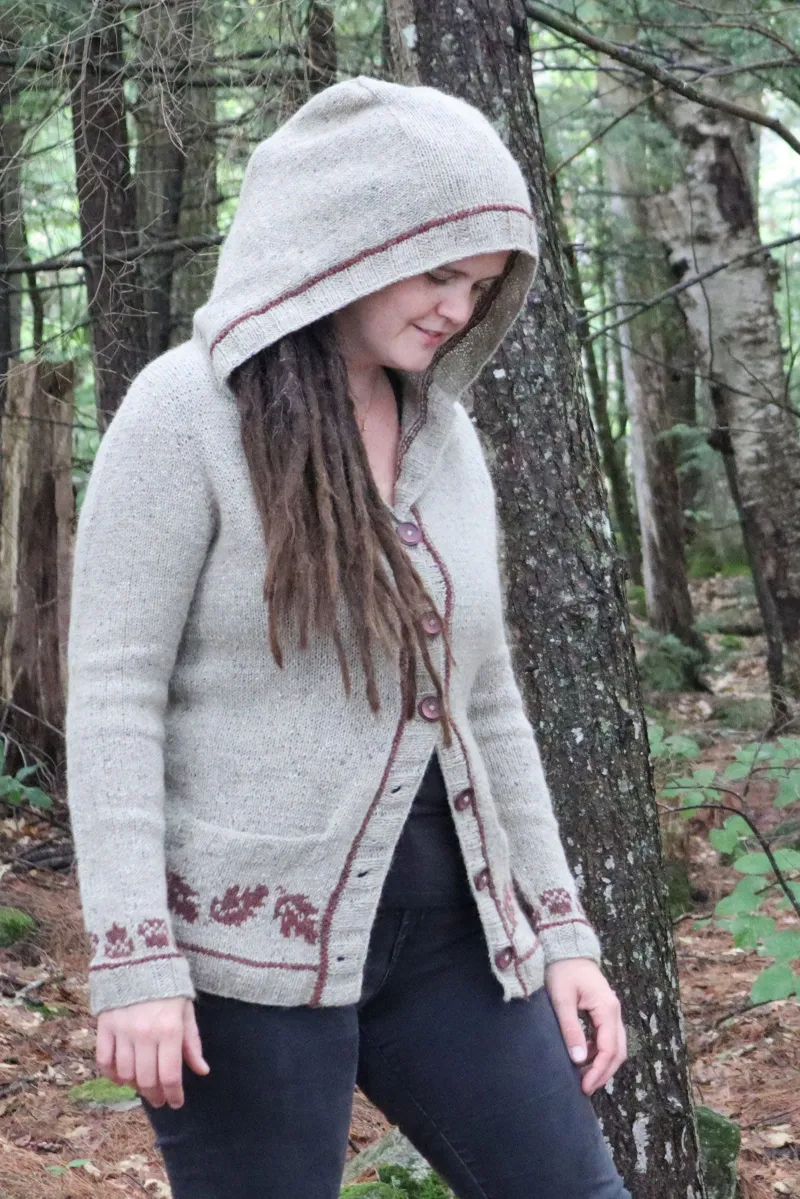 Kristen TenDyke Germania Hoodie knitting pattern showing hooded cardigan with nature-inspired colorwork