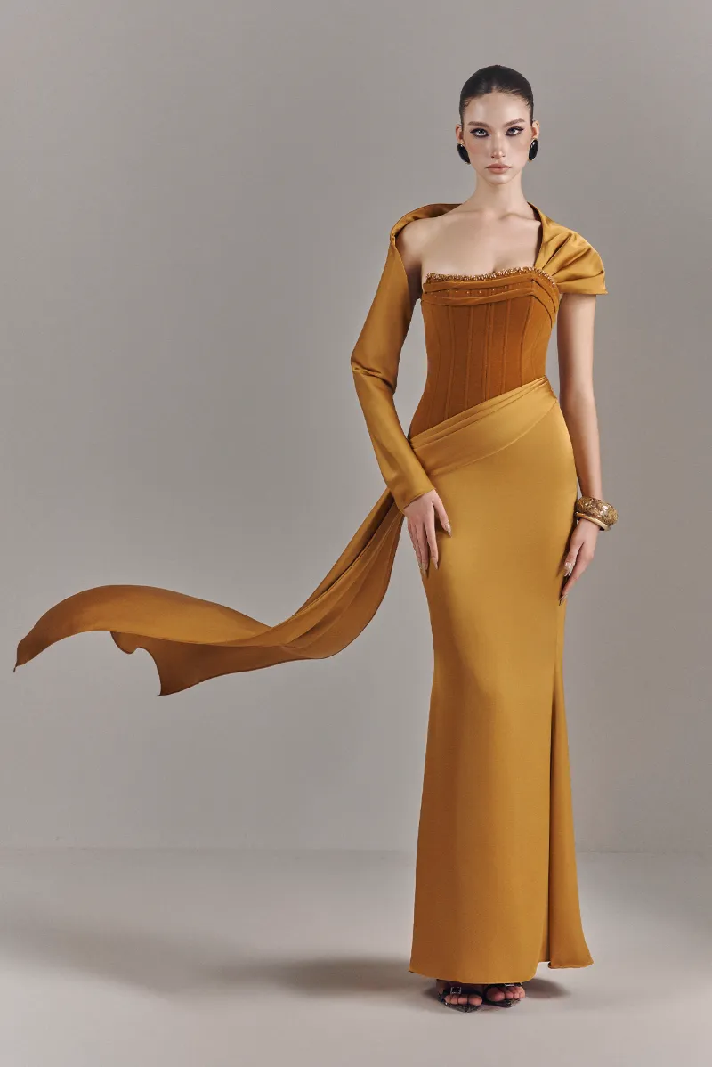 Kalisa Julia Strapless Corset Maxi Dress in saffron gold with one-sleeve draped scarf