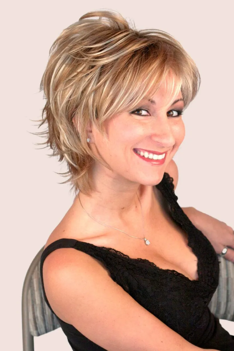 Godiva's Secret Wigs Freedom Large w/ Roots medium wig in Nutmeg-F with teased crown and wispy layers