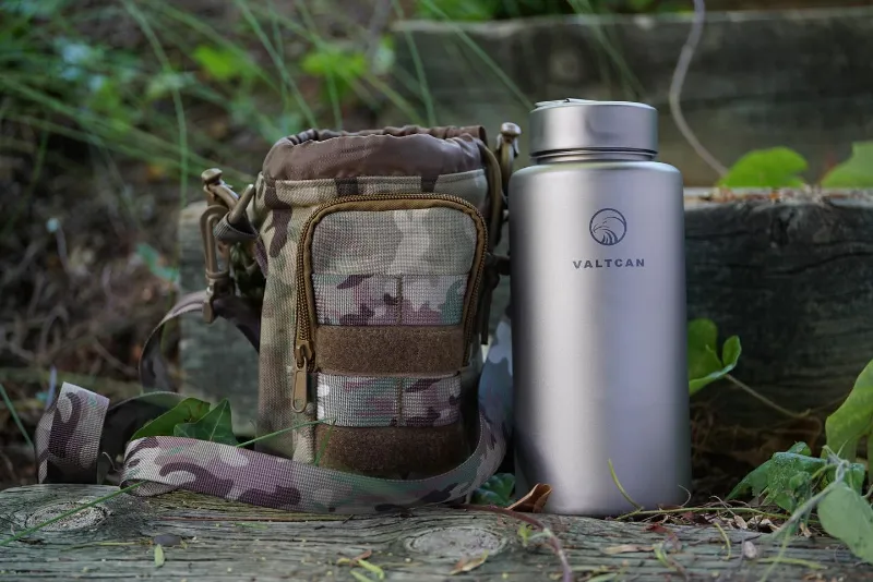 Valtcan 1000ml Titanium Water Bottle on workbench, bare metal finish
