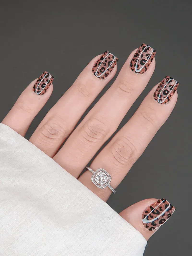 Roxy Nails Paris Feline short square nails with leopard print and copper shimmer