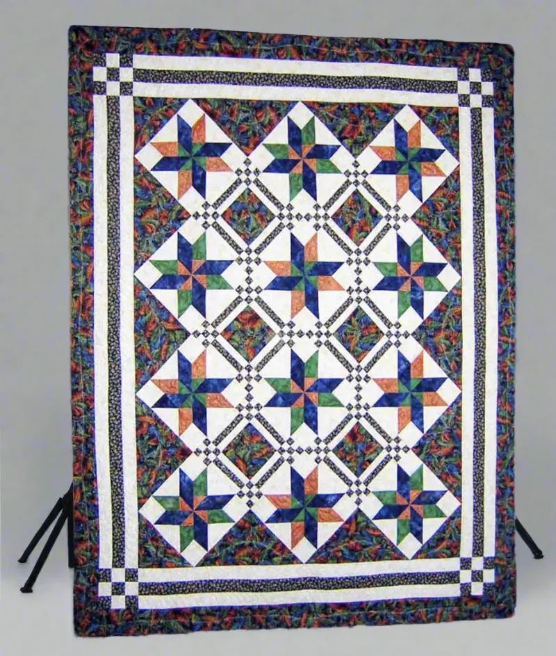 Boho Blanket Jewel of the Night Quilt Pattern showing a richly colored quilt in two bed sizes