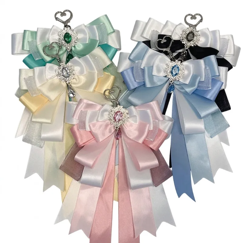 Shoptery Fairy Kei Layered Satin Bow Charm Pendant with Crystal Jewel shown close up, layered bow bag charm