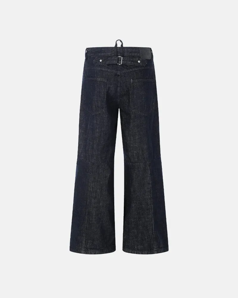 INFLATION Cinch Back Raw Baggy Jeans in dark raw indigo denim with adjustable buckle-back waistband detail