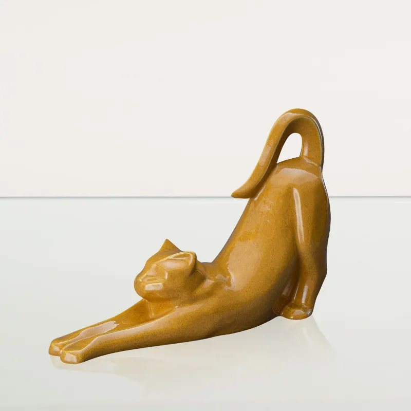 Pulvis Art Urns Grace cat cremation urn in amber yellow ceramic showing stretching cat pose