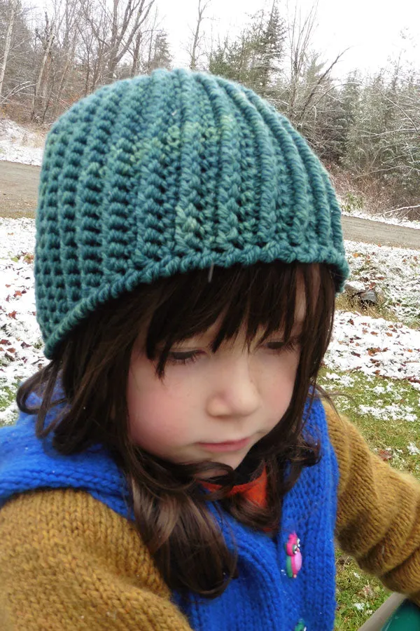 Kristen TenDyke Jackson Cap crochet pattern showing a ribbed beanie in teal