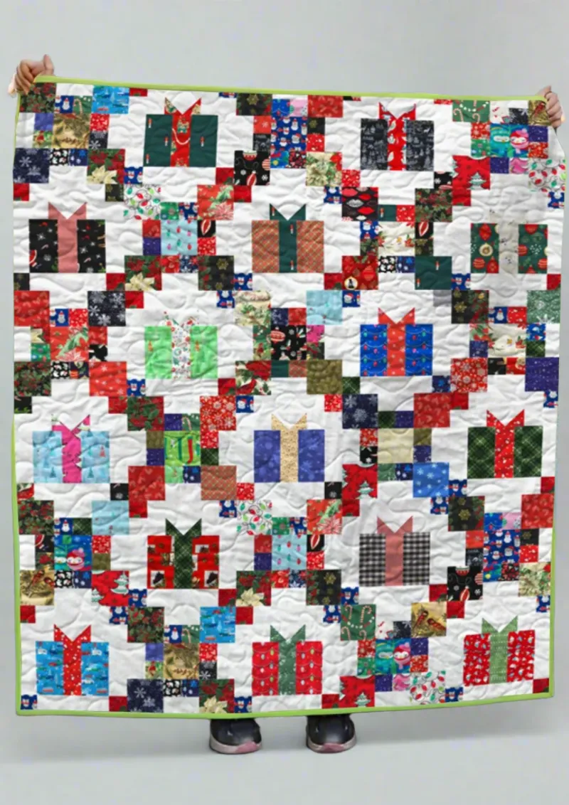Boho Blanket Gift Wrapped Joy Quilt Pattern cover showing a bold graphic quilt with layered color