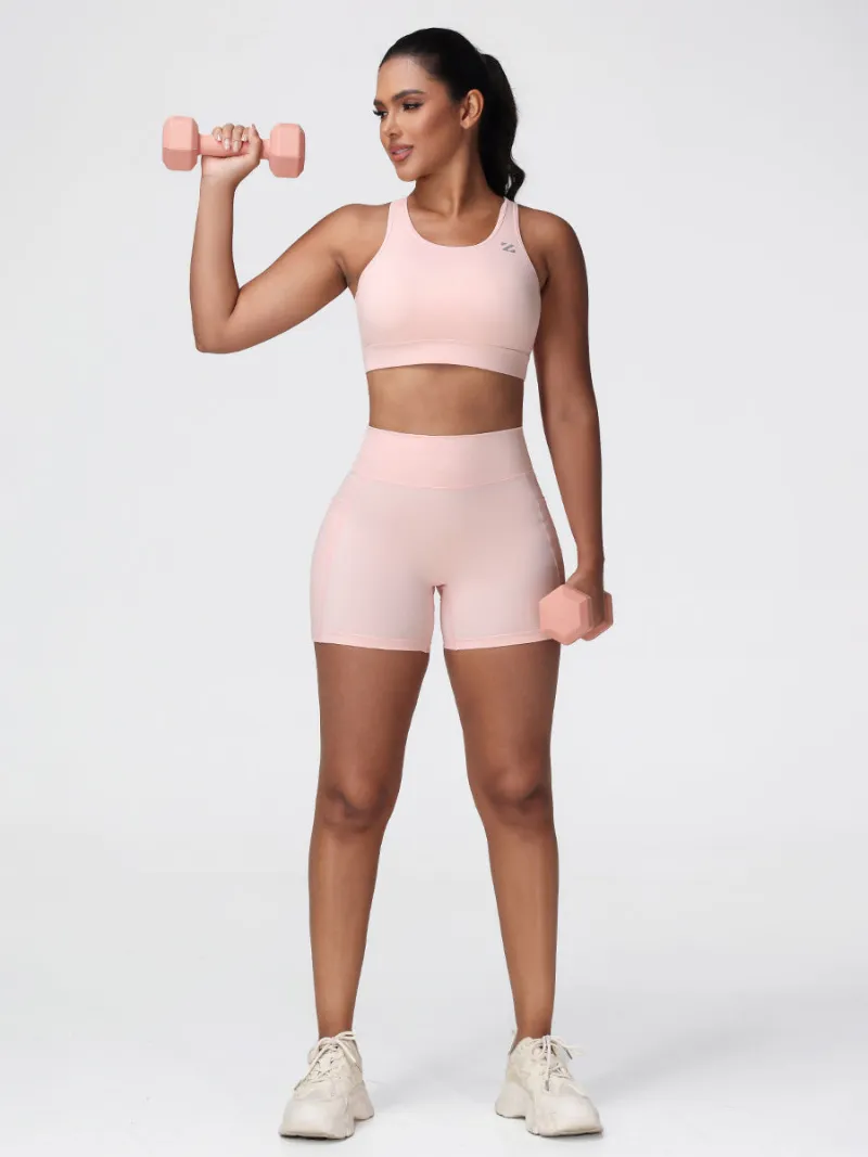 Zuluzenith Workout Set for Women Sports Outfits, sports bra and shorts in Cranberry Red on model
