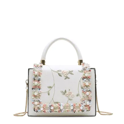 Bond & Mason The Bridget Handbag showing compact vegan leather bag with lace and flower detailing