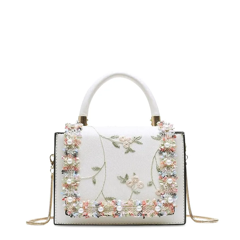 Bond & Mason The Bridget Handbag showing compact vegan leather bag with lace and flower detailing