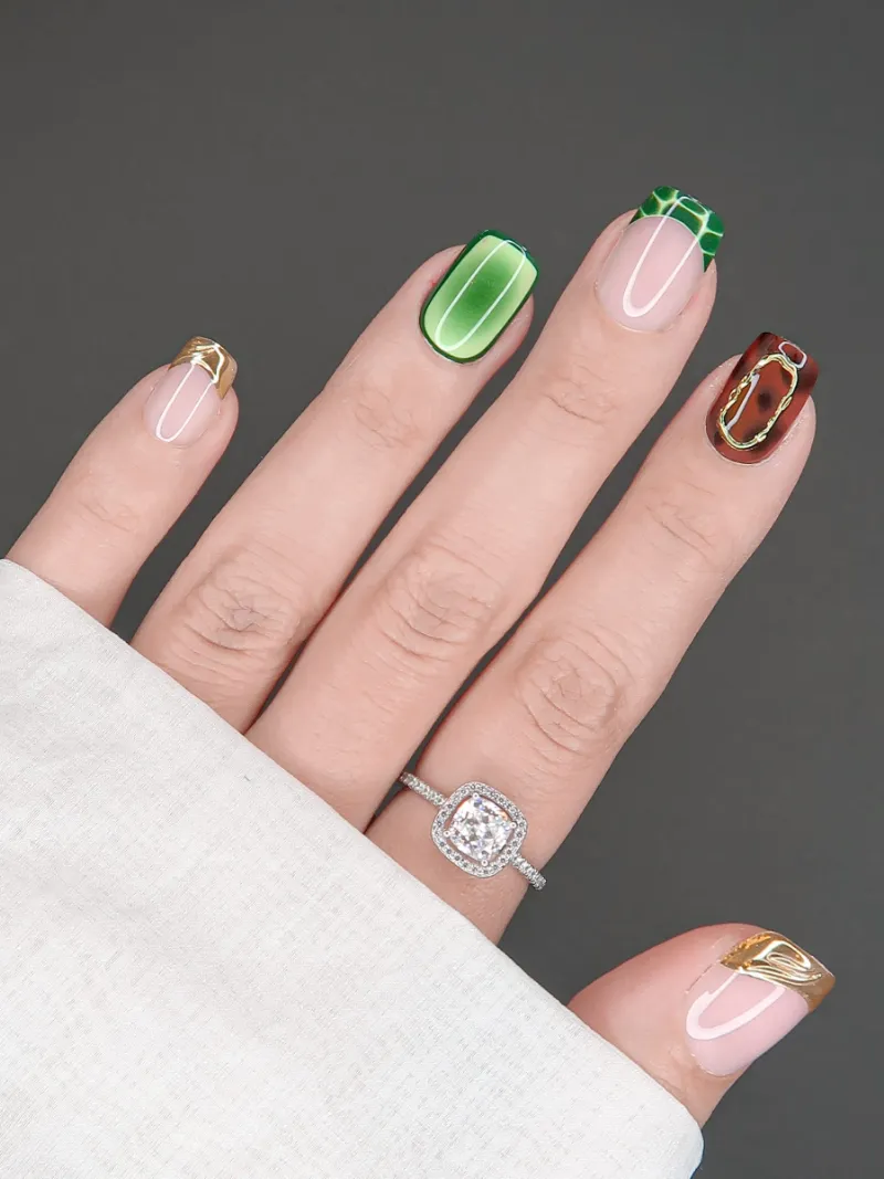 Roxy Nails Paris Basic instinct extra short nails with emerald crocodile, tortoise shell, and gold accents