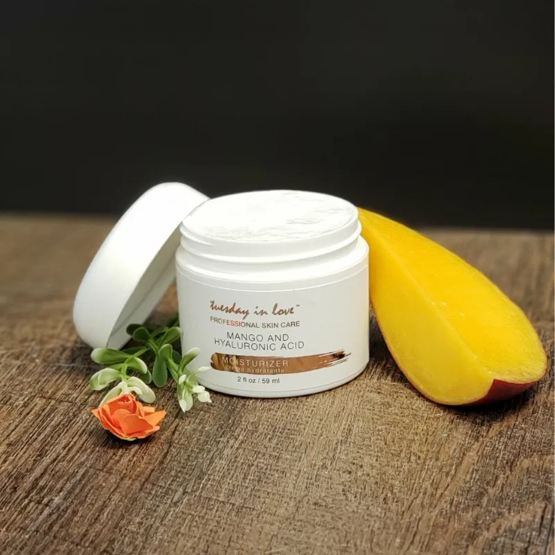 Tuesday in Love Mango & Hyaluronic Acid Moisturizer bottle on white background