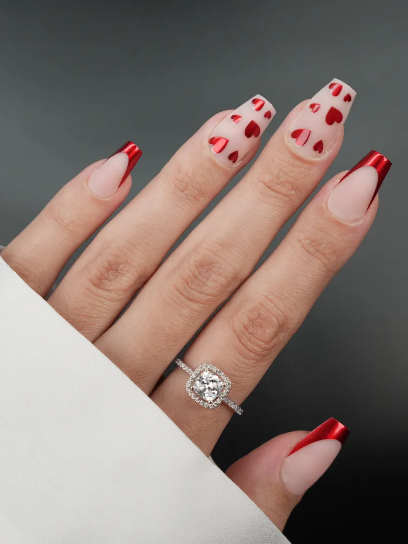 Roxy Nails Paris Irresistible press-on nails with matte nude base, red chrome hearts and french tips