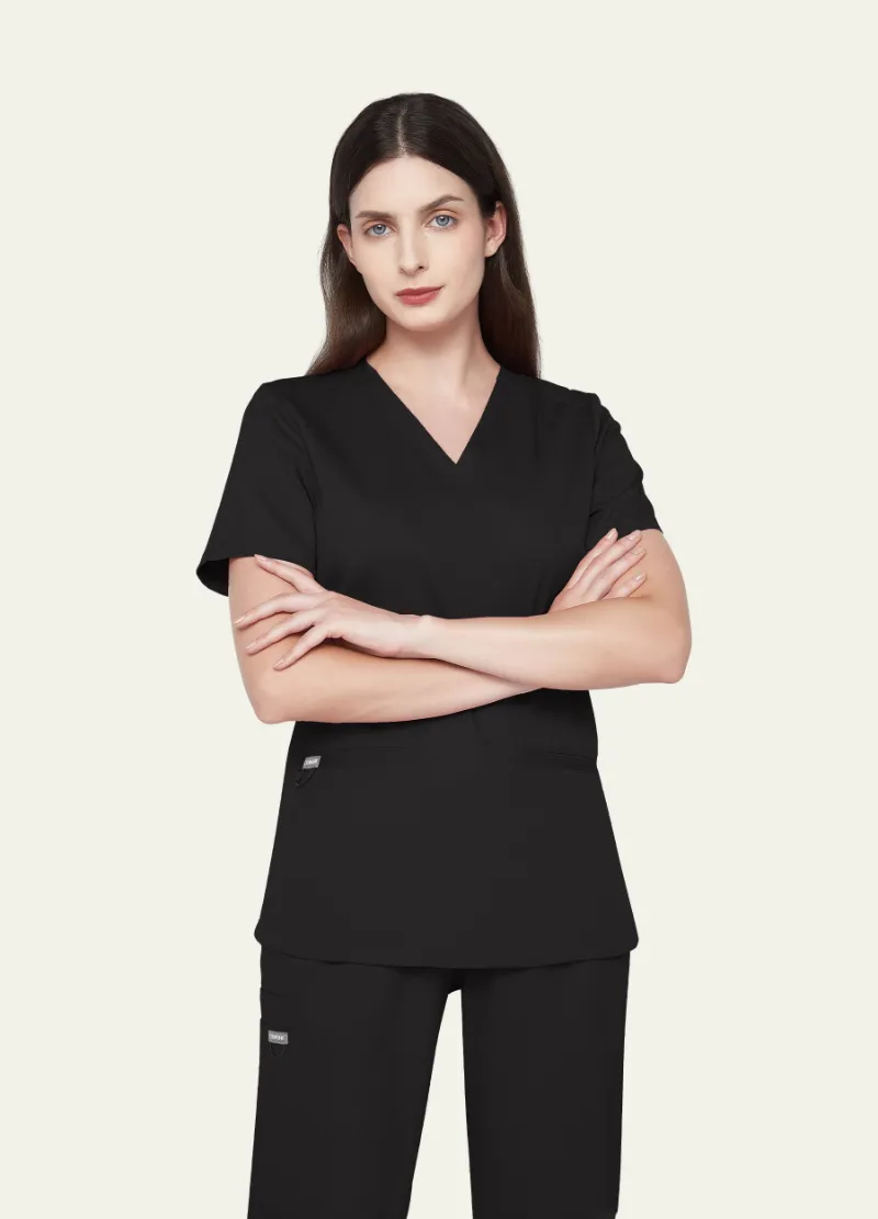 COMENII SoftTouch Essential Scrub Top in black with v-neck and pocket details