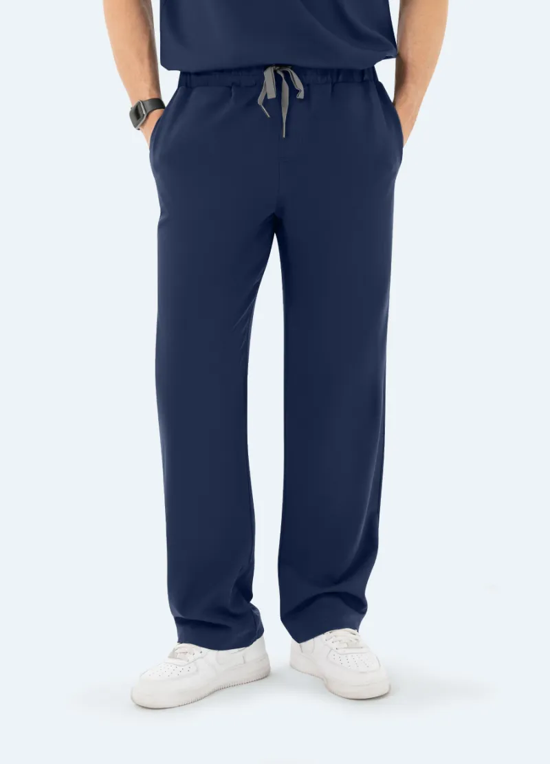 COMENII DynaComfort™ Essential Scrub Pant in Navy shown full-length, highlighting the straight-leg fit and pocket placement