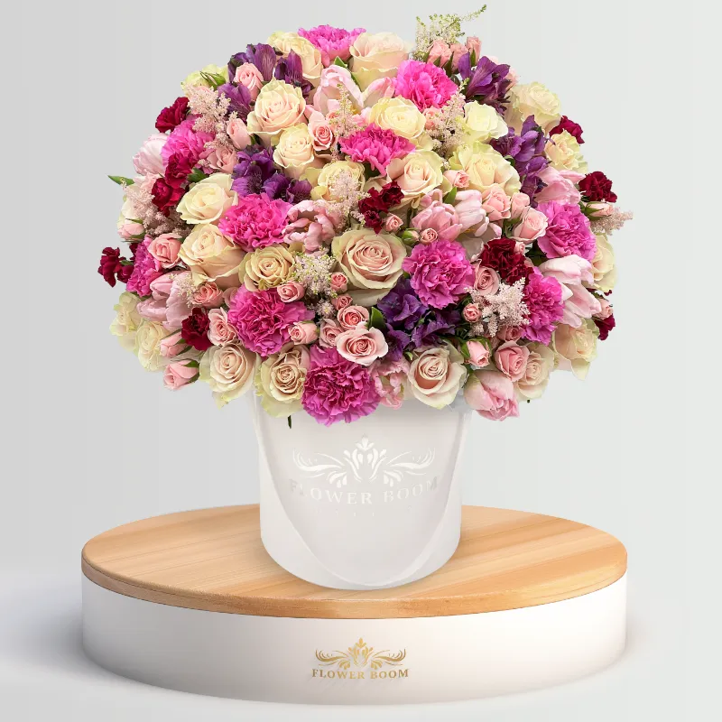 Flower Boom Dallas Color Boom arrangement with mixed signature roses, carnations, and spray roses in vibrant colors