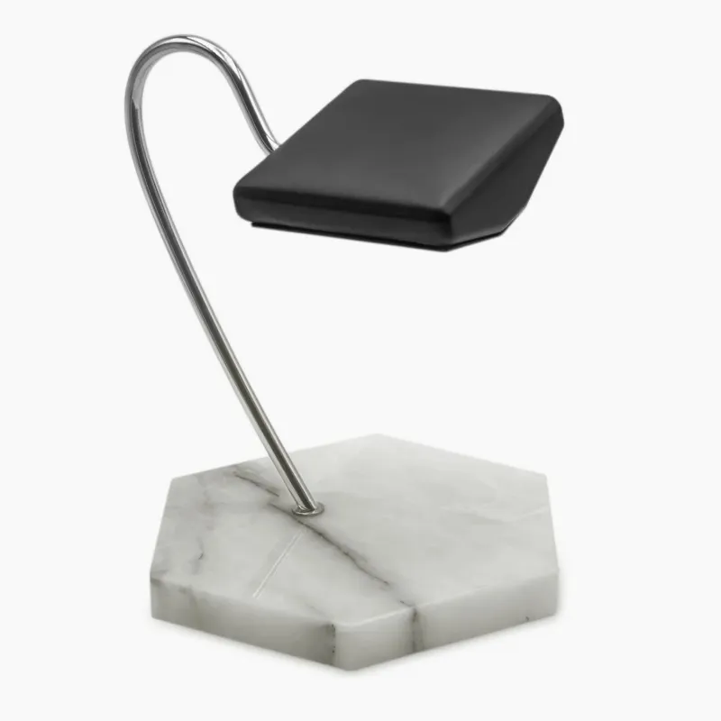 Rotation Horlogère Porte Montre Homme en Marbre with leather cushion on marble base