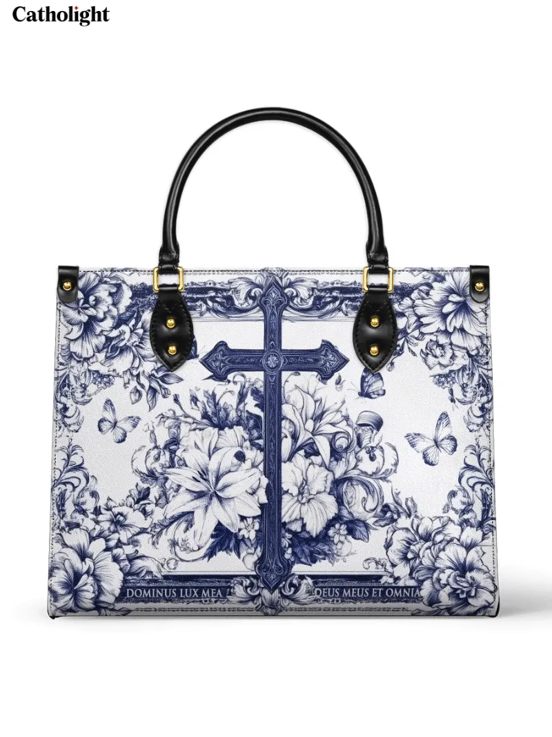 Catholight The Cross Amidst Blooming Faith Leather Bag with blue cross, lilies, and butterflies
