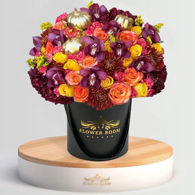 Flower Boom Dallas Autumn Luxe, fall bouquet with orange, purple and burgundy blooms and gold pumpkins