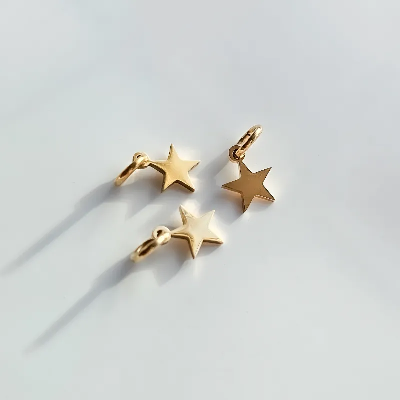 DORSYA Star Charm in 18K gold plated stainless steel shown against white background