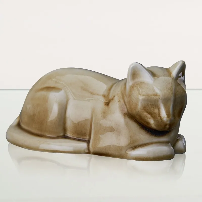 Pulvis Art Urns laying cat cremation urn in dark sand ceramic finish