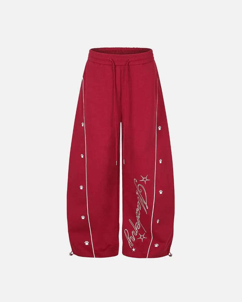 INFLATION Contrast Piping Graphic Barrel Sweatpants in red with white piping detail and graphics