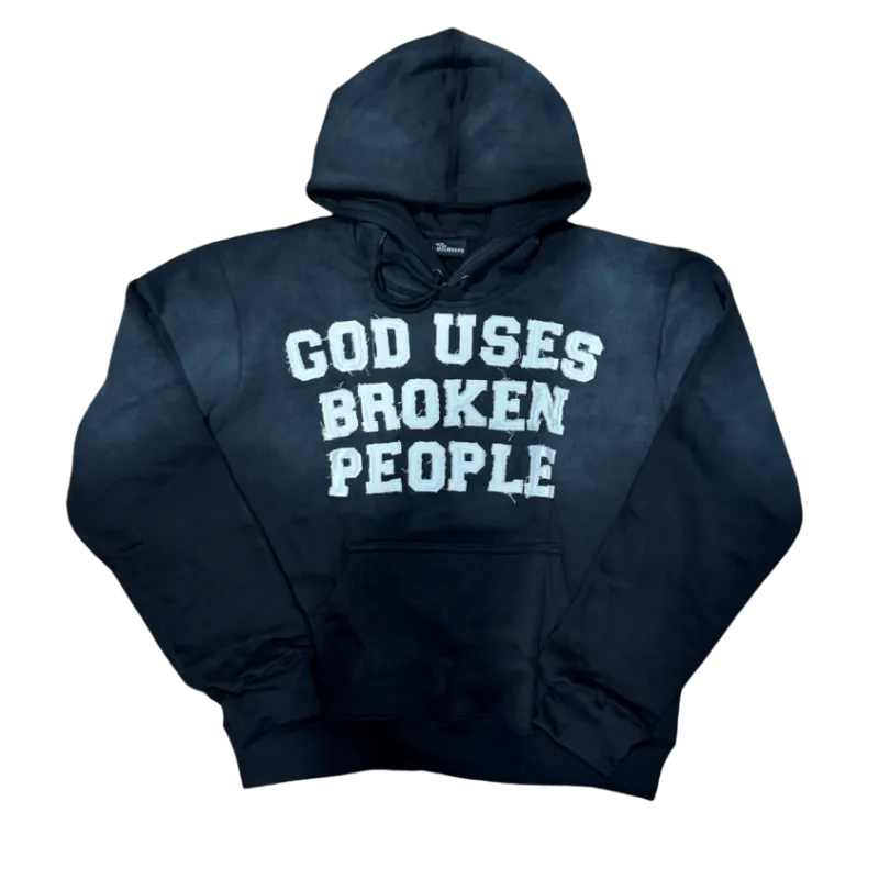 We The Believers God Uses Broken People hoodie in black acid wash with lettering across chest