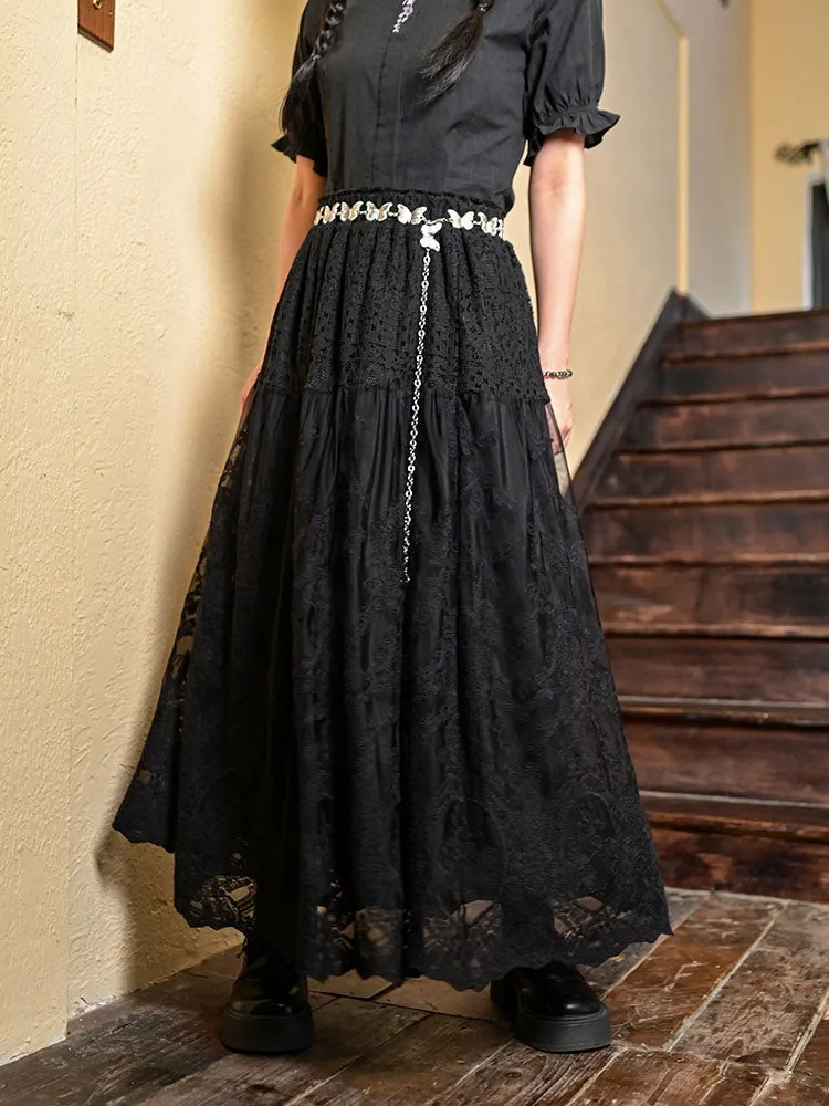 Juwas Black Hollow Floral Lace Midi Skirt displaying the floral pattern and flowy hemline.