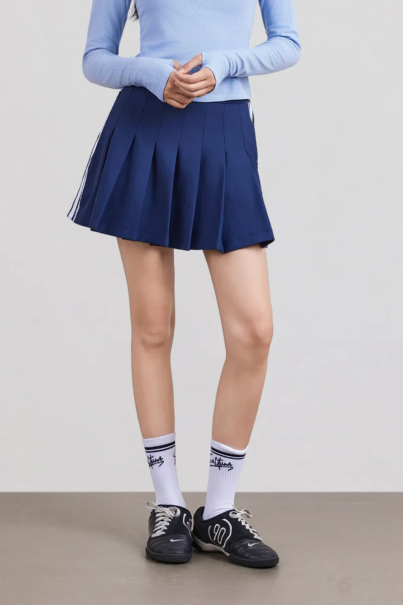 SALTUM Brushed Pleated Tennis Skirt in high-rise A-line silhouette with contrast side tape