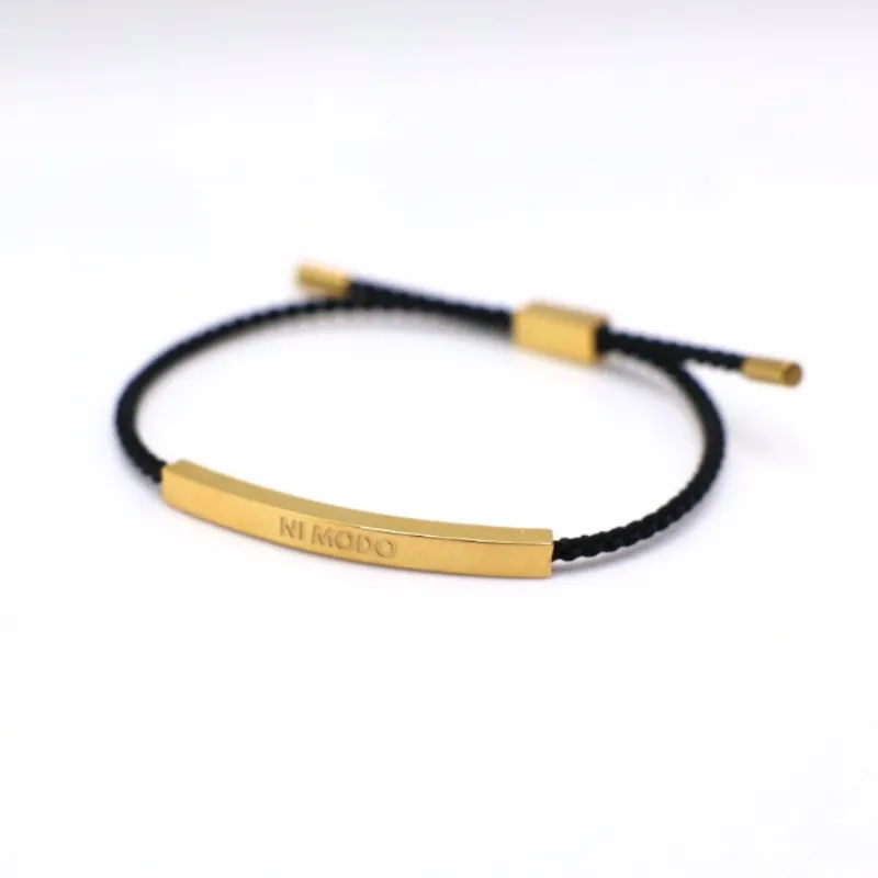 Nimodo Ni Modo Bracelet in black with brand lettering