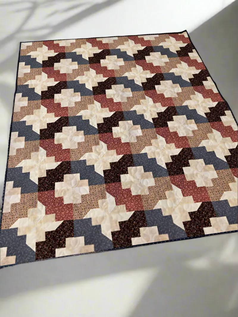 Boho Blanket New Pinwheel Garden Quilt Pattern cover showing a pinwheel quilt design