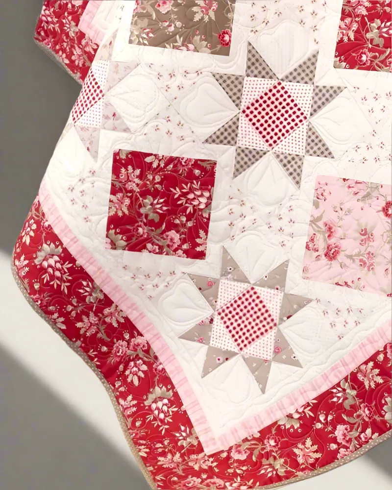Boho Blanket Blossom Serenade Quilt Pattern, a large quilt with layered texture and bold graphic shape