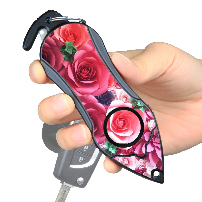 The Stinger Tools Stinger Personal Safety Alarm Keychain in Pink Rose with siren, seatbelt cutter, and glass breaker