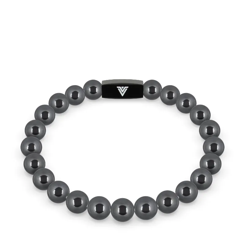 VOLTLIN Hematite Stretch Bracelet on display with black suede pouch