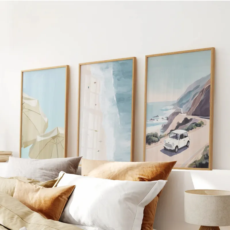 Wall Art Set Coastal Wall Art Set of 3 showing three framed beach and ocean prints with car and umbrellas