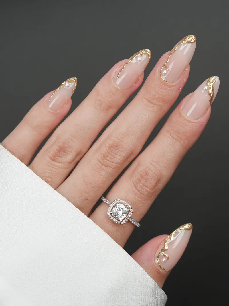 Roxy Nails Paris Opulence press on nails with 3D gold ornaments and white pearls on nude base