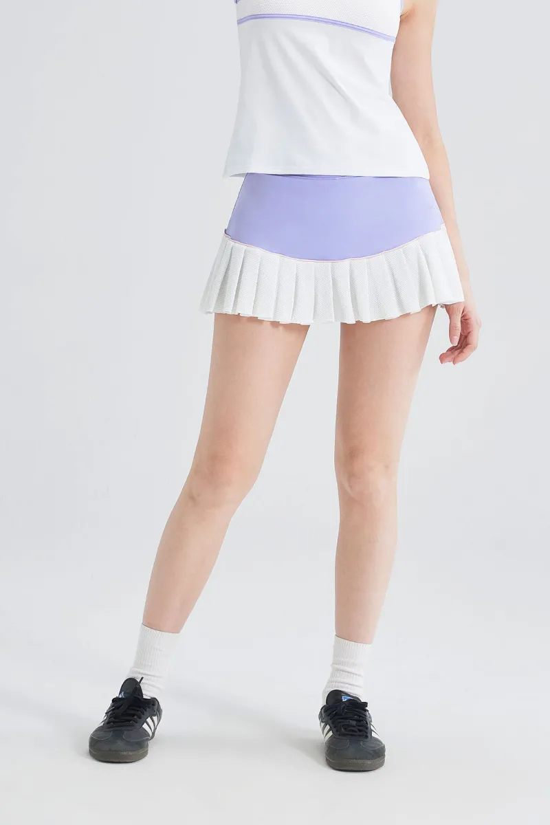 SALTUM High-Waist Pleated Tennis Skirt with color-blocked waistband and pleated hem