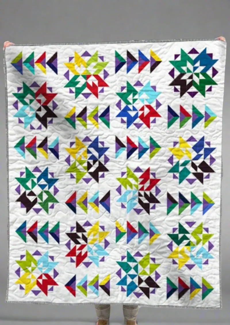 Boho Blanket Aurora Burst Quilt Pattern, pattern cover showing a striking aurora-inspired quilt