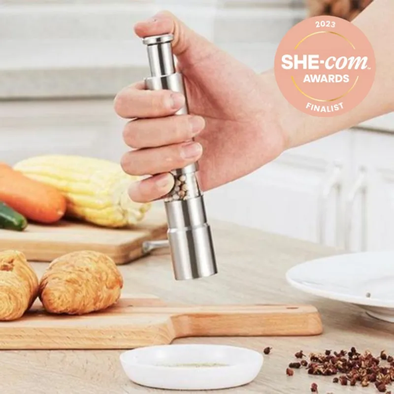 Tweed Real Food stainless steel spice grinder with press-top mechanism