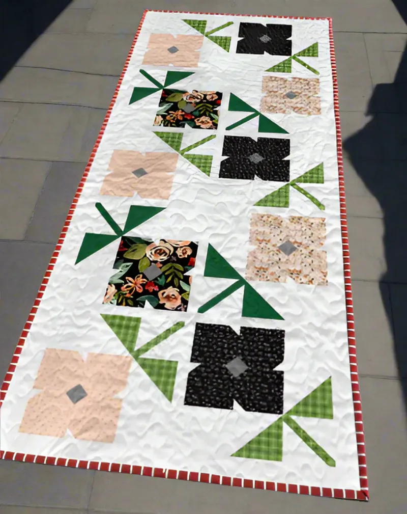 Boho Blanket Garden Pathway Quilt Pattern cover showing a bold graphic quilt inspired by tree rings
