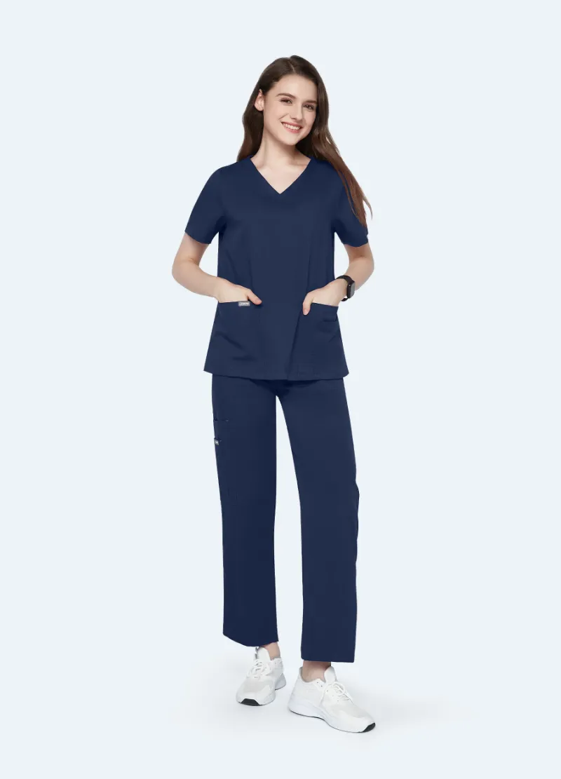 COMENII StyleFlex 10-Pocket Essential Scrub Set in Navy, front view showing V-neck top and cargo pants