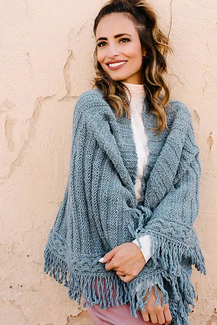 Kristen TenDyke Arced Shawl knitting pattern showing curved shape with cable border and fringe detail