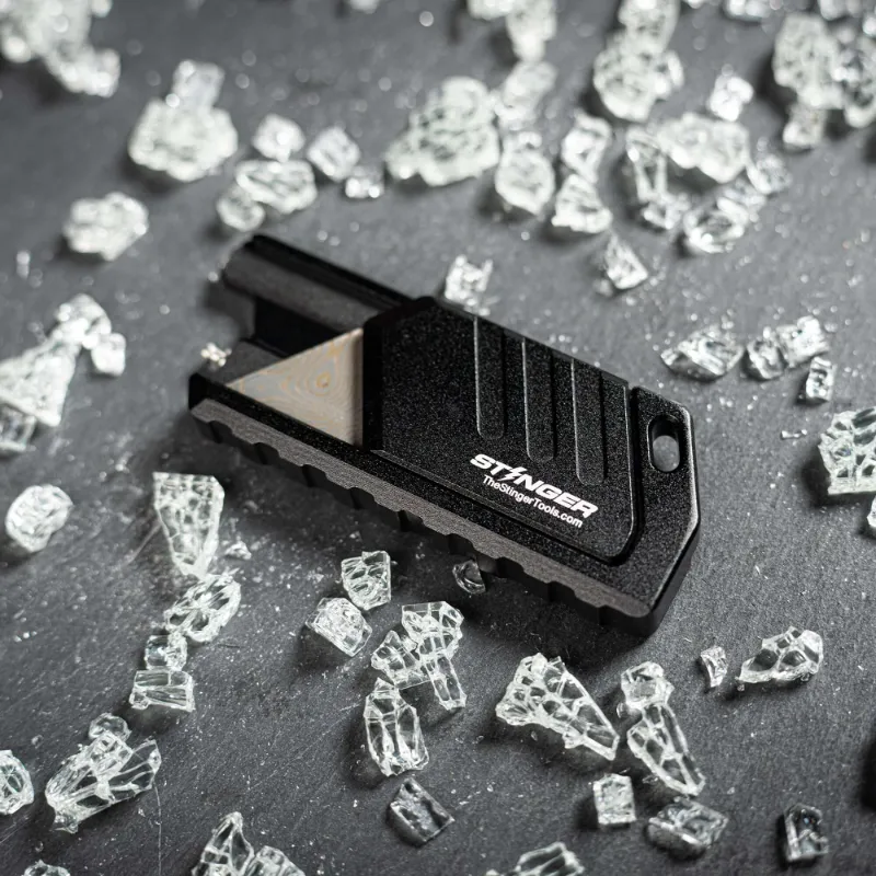 The Stinger Tools Stinger MagSlide Utility Knife, compact silver knife with magnetic closure
