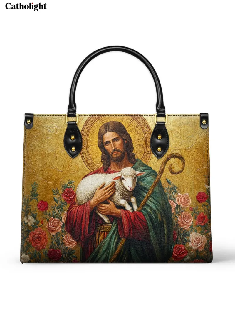 Catholight Lamb of Grace Leather Bag showing Jesus as Good Shepherd holding a lamb with roses and gold details