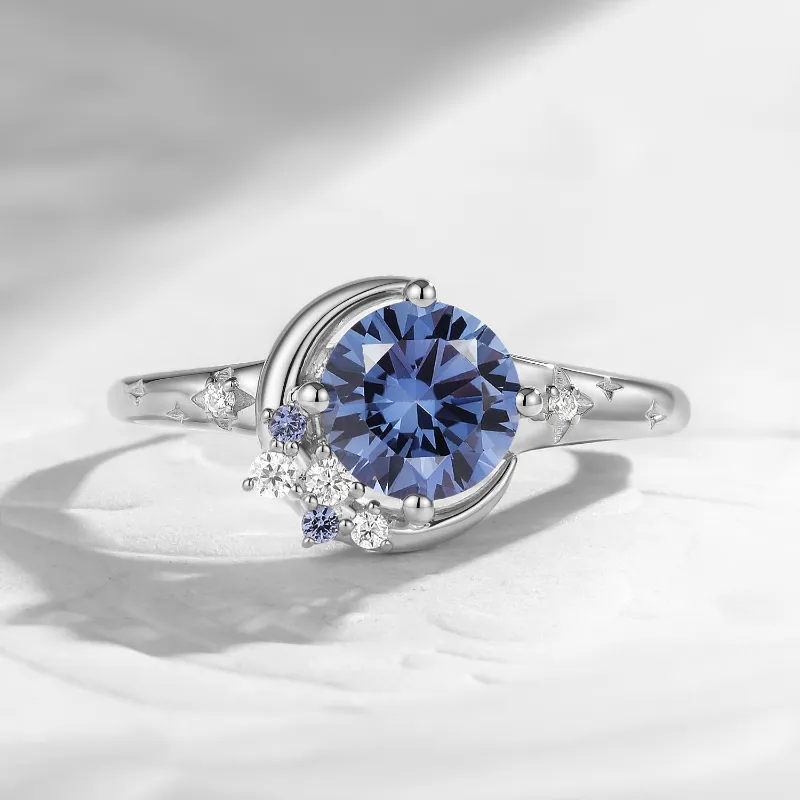 Starlandus Moonlit Embrace round lab sapphire crescent moon and star engagement ring with star engraved band