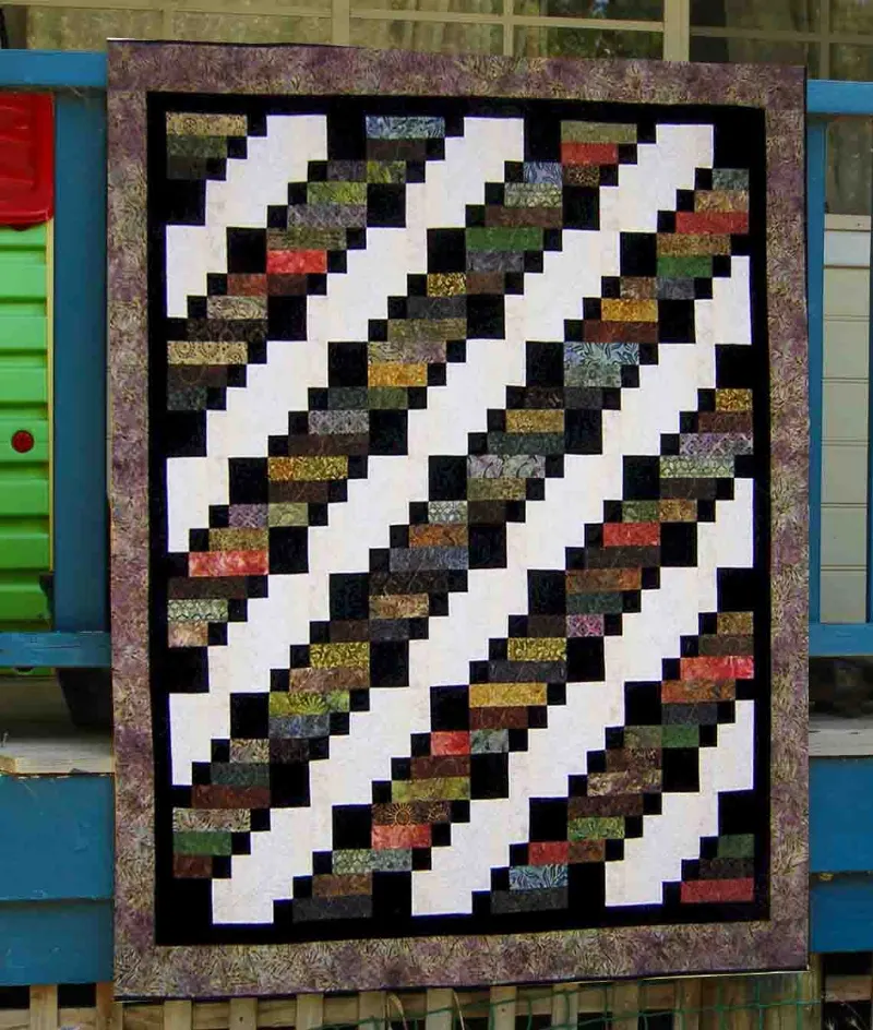 Boho Blanket Evening Walk Quilt Pattern, a graphic tree-ring quilt in twin and queen sizes